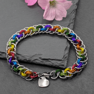 Chainmaille bracelet made in the Viperbasket weave. Made with silver and rainbow coloured aluminium rings