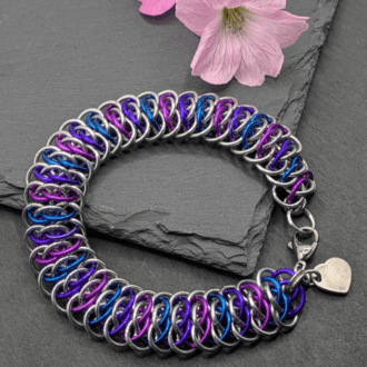 Chainmaille bracelet made in the Viperscale weave. Made with silver and blue, purple and violet aluninium rings