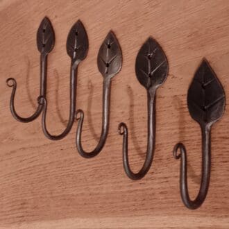 blacksmith made hooks with a leaf shaped top.