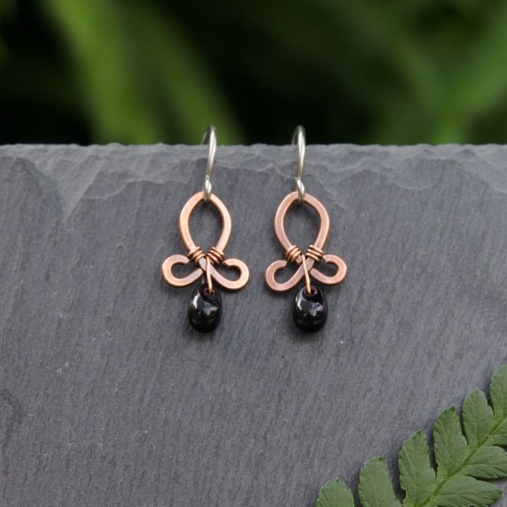 cute copper dangle earrings with black beads by oruki design