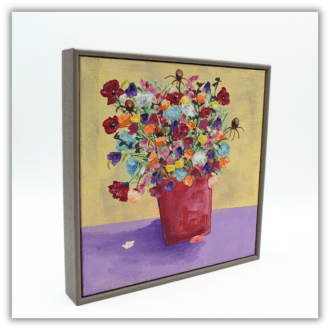 This is an original framed painting of a vase of colourful flowers.
