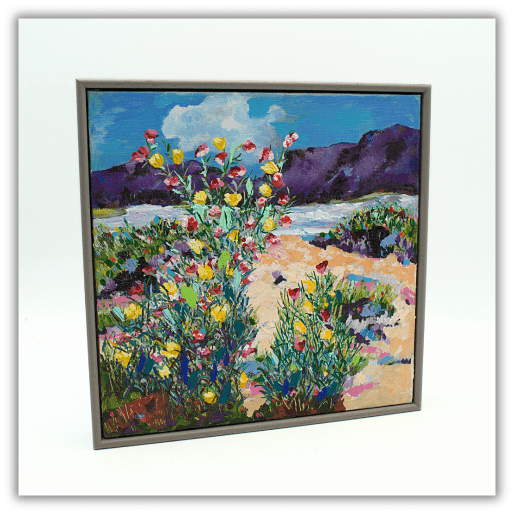 A framed acrylic painting of wildflowers at the coast. 21.5 x 21.5 x 3 cms.