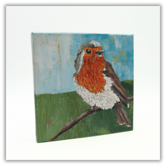 An original painting of a robin perched on a twig. Ready to hang.