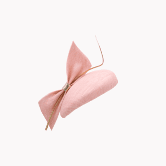 Pale pink teardrop shaped percher hat with large bow and gold curled quill feather