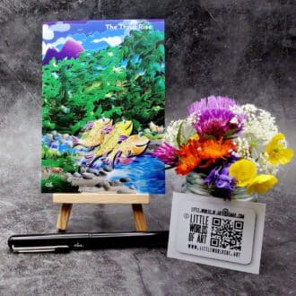 Image showing an A6 size greetings card, blank inside, on a small easel. Artwork depicts a colourful, gently humorous river scene of three trout rising (jumping) for their evening meal - a flying bug.