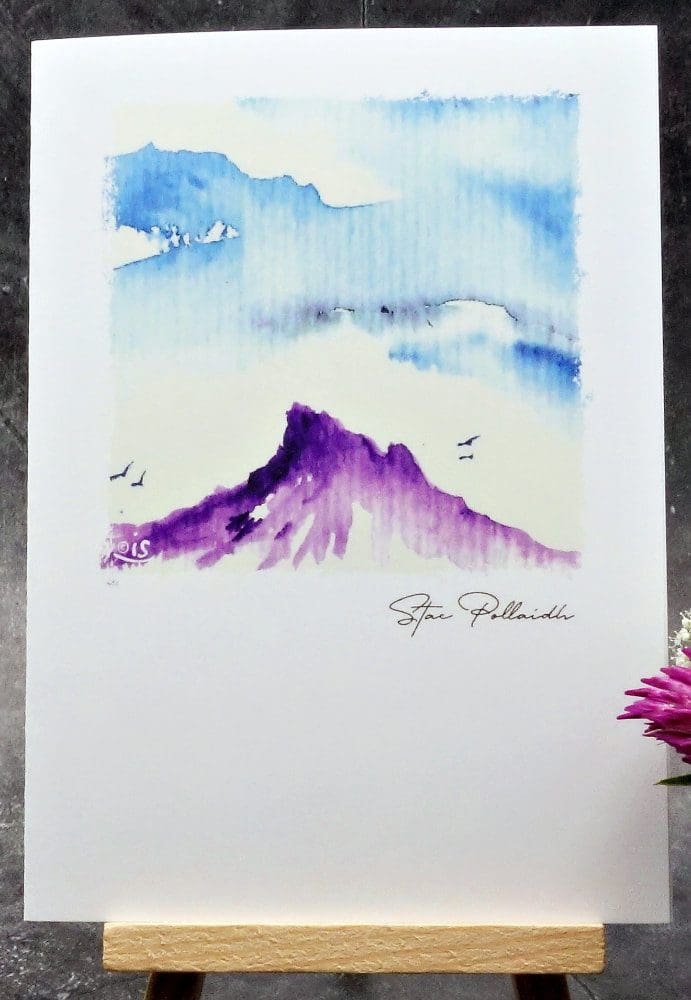 Larger image showing an A6 size greetings card, blank inside, on a small easel displaying a view of Stac Pollaidh from the North. Coigach, Assynt.