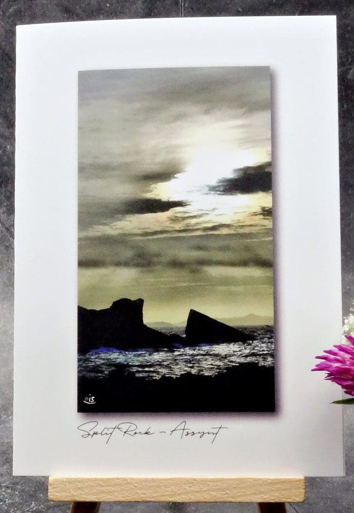 Larger image showing an A6 size greetings card, blank inside, on a small easel displaying a view of Split Rock at Clachtoll in Assynt!