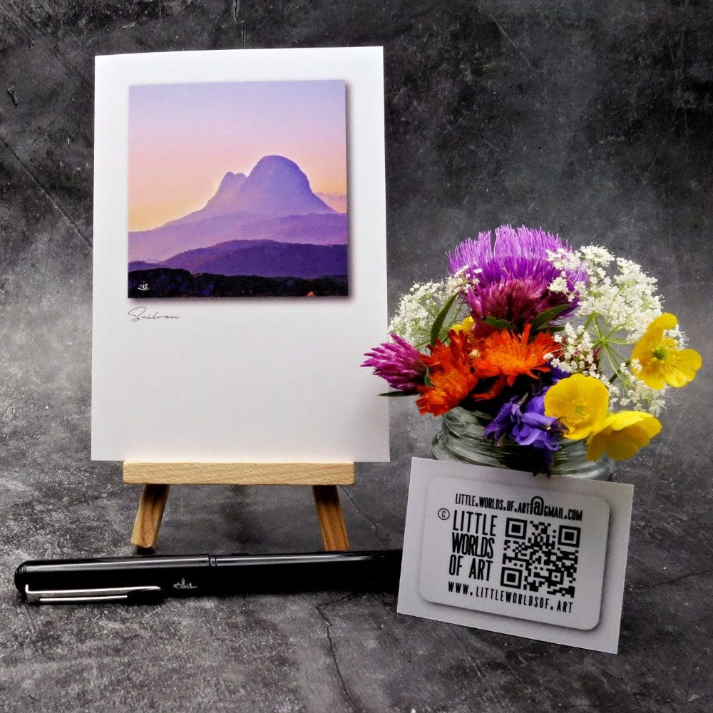 Image showing an A6 size greetings card, blank inside, on a small easel displaying a summer's evening view of Suilven in Assynt!