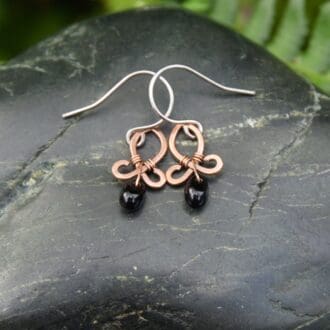 small handmade copper drop earrings with black glass beads by oruki design