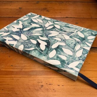 Handmade A5 notebook filled with plain paper covered in fabric