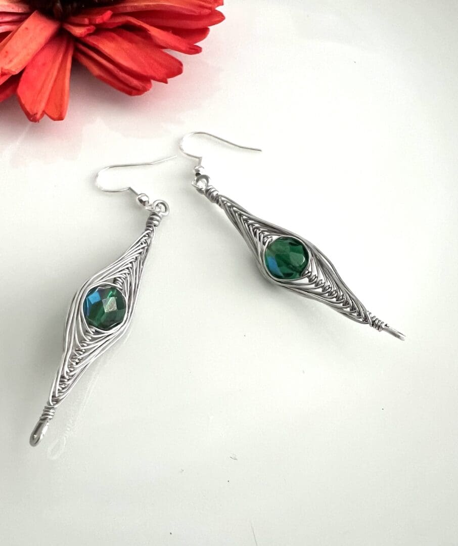 Aluminium Herring Earrings with Green Lustre Beads