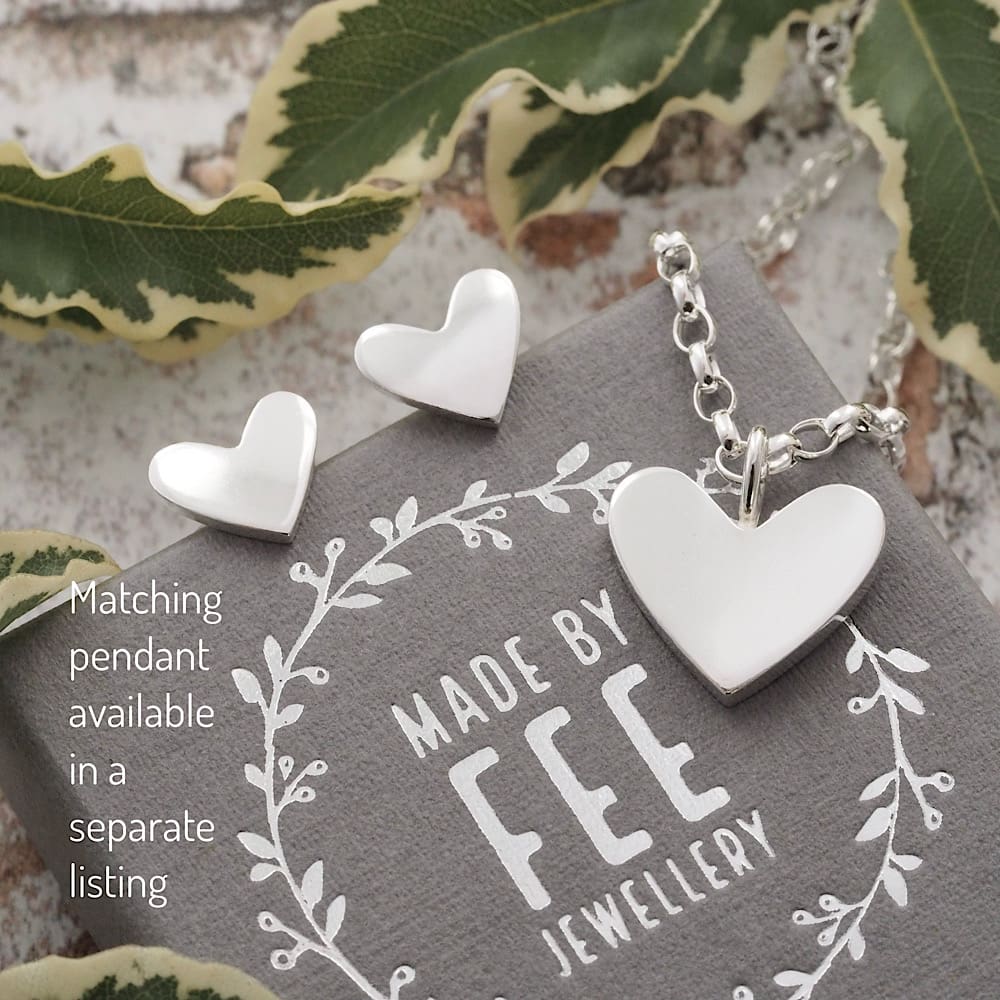 Argentium sterling silver heart pendant and matching earrings with smooth shiny finish.