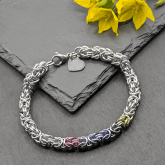 Chainmaille bracelet made in the byzantine weave. Made with silver and pastel coloured aluminium rings