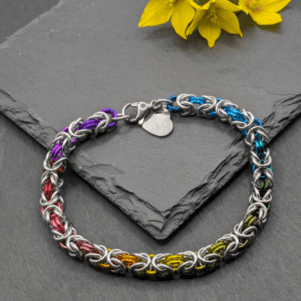 Chainmaille bracelet made in the byzantine weave. Made with silver and rainbow coloured aluninium rings