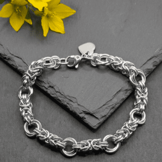 Chainmaille bracelet made in the byzantine rose weave. Made with aluminium rings (silver in colour)