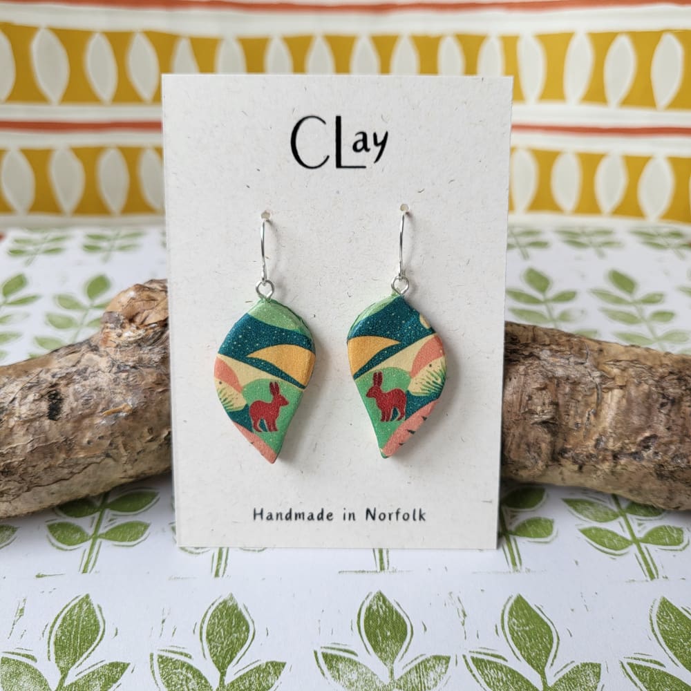 Leaf shaped dangle earrings with a hare pattern