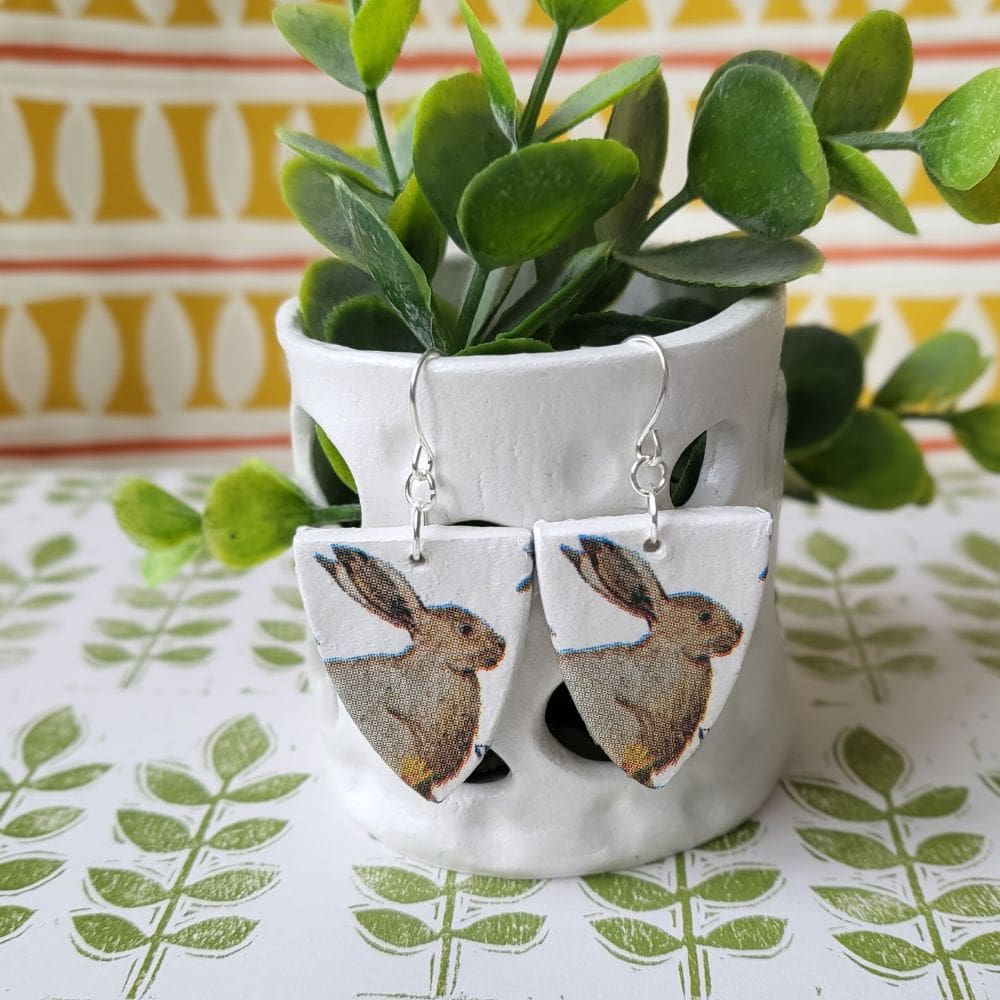 Dangle earrings featuring a country hare print