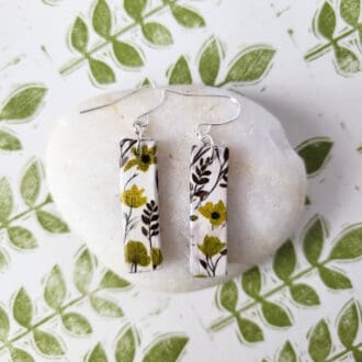 Rectangle dangle earrings with a floral pattern