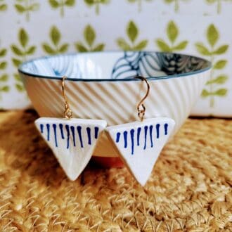 Triangle shaped dangle earrings hand painted with blue lines