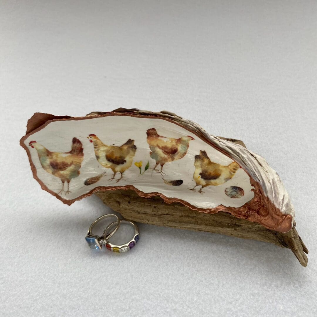 Decoupaged shell with hens