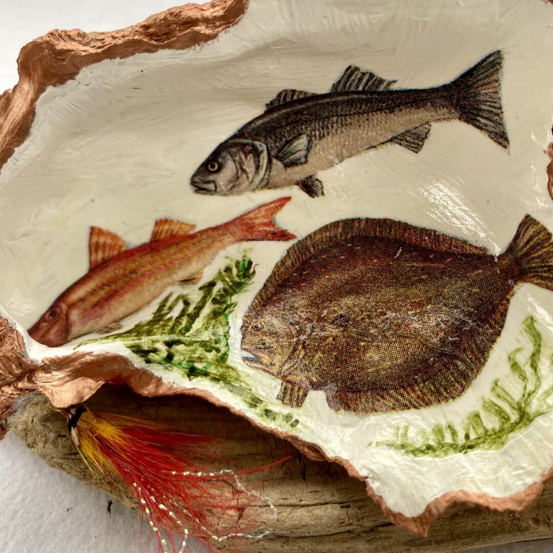 Decoupaged shell fishing fish