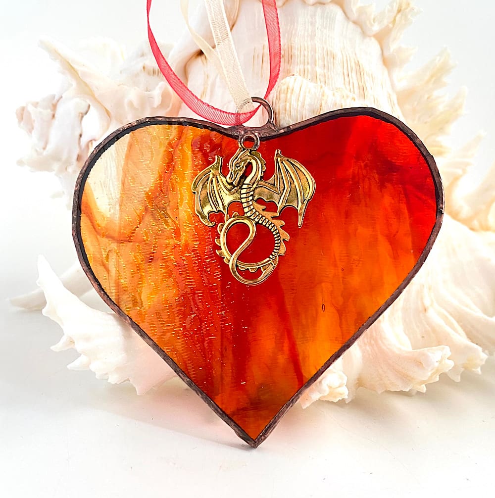 Red streaky stained glass heart with dragon charm