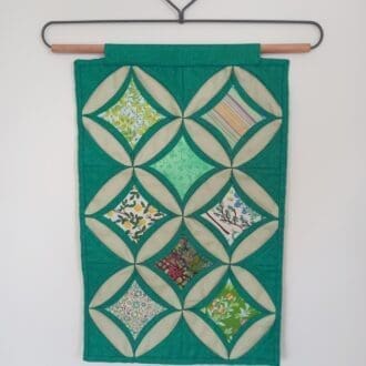 Jade green patchwork wall hanging