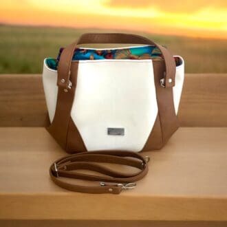 larger size ladies handbag in cream and tan faux leather carry handles and crossbody strap