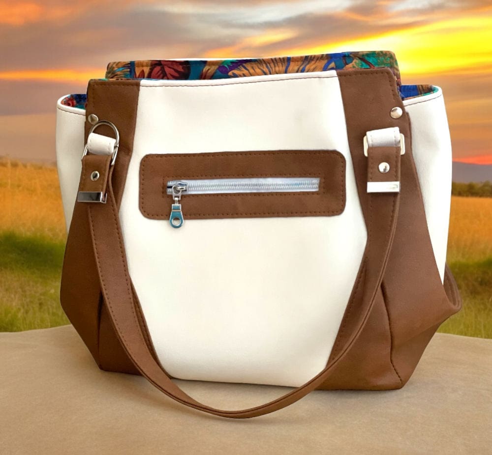 cream and tan handbag with rear zip pocket