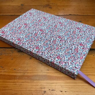 A5 lined handmade notebook covered in Katie & Millie Liberty fabric