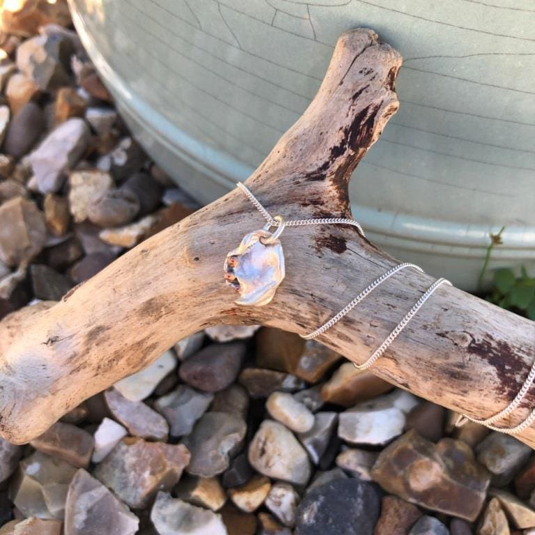 Silver-&-copper-water-cast-necklace-on-driftwood