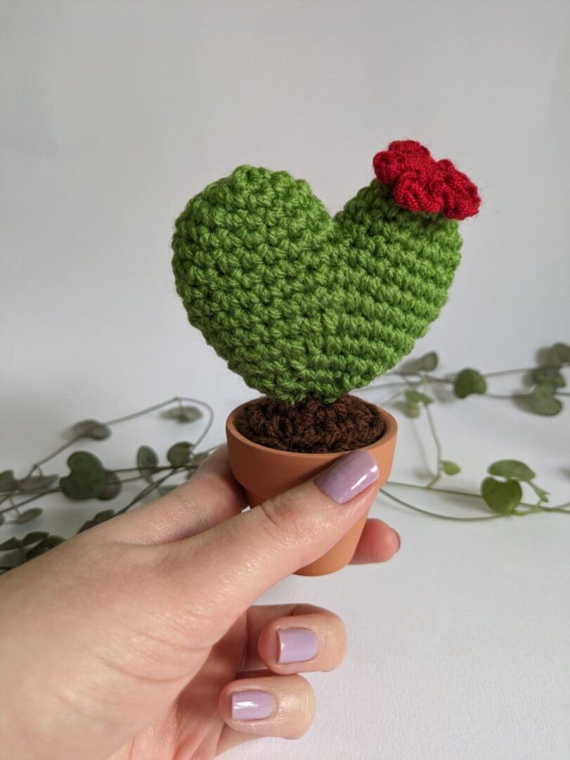 Heart Crochet Cactus in a Terracotta Pot held in Hand for Size Reference