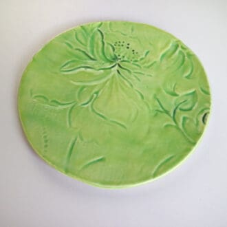 Stoneware ceramic plate in green botanical design