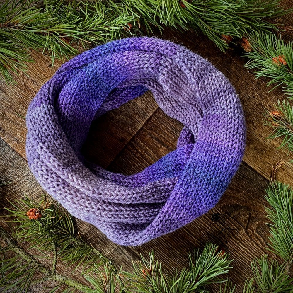 Knitted vegan infinity loop scarf in all the shades of purple