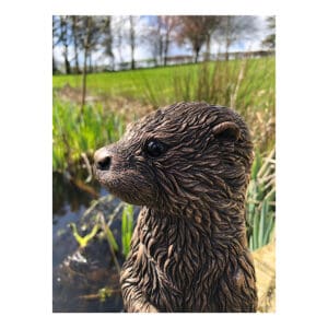 Close up of the bronze otter sculpture by Kirsty Armstrong