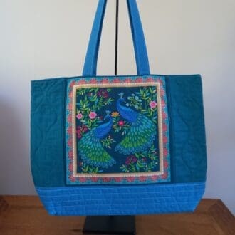 Blue peacocks tote bag