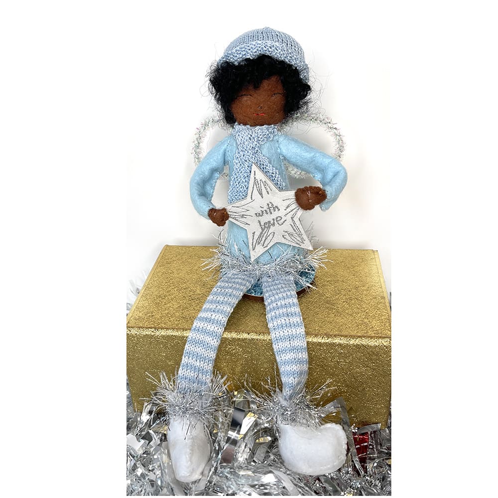 Dark-skinned shelf-sitting Christmas angel holding a star and wearing everyday clothes.