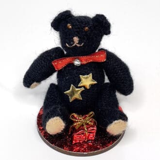 Miniature teddy bear Christmas decoration with red tie and gift