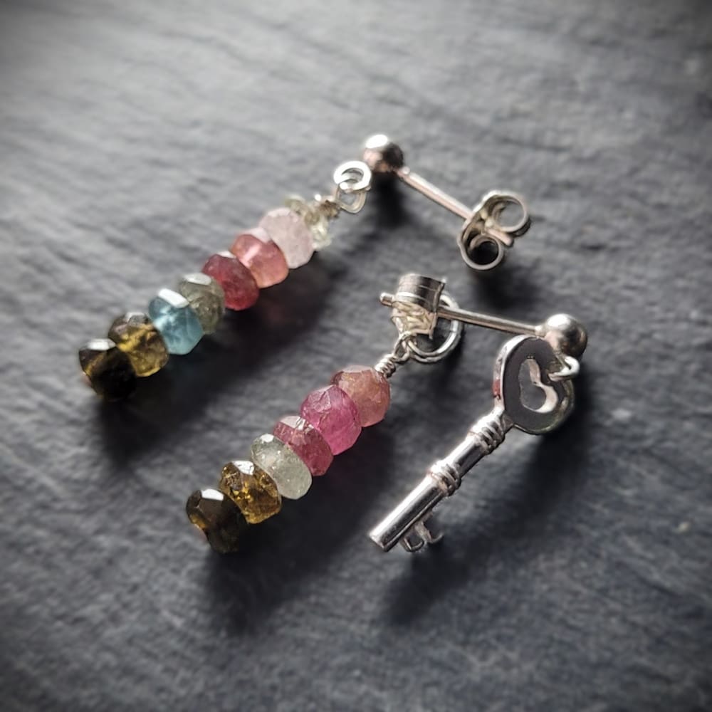 Key of Freedom Earrings. Asymmetrical earrings in sterling silver and watermelon tourmaline. One earring in the pair features a key charm as well as the multicoloured beads.