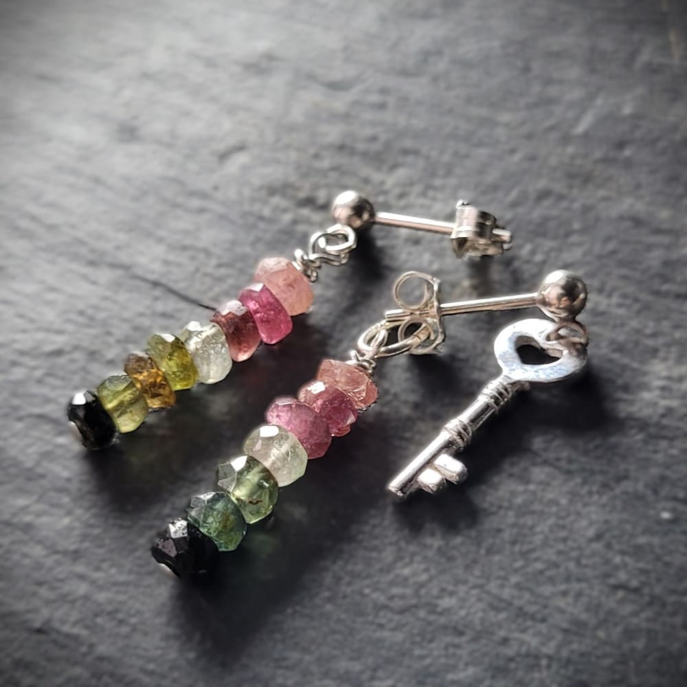 Key of Freedom Earrings. Asymmetrical earrings in sterling silver and watermelon tourmaline. One earring in the pair features a key charm as well as the multicoloured beads.