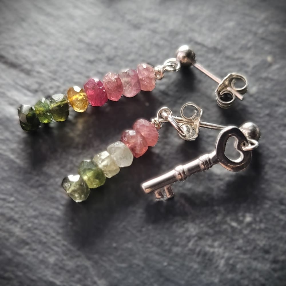 Key of Freedom Earrings. Asymmetrical earrings in sterling silver and watermelon tourmaline. One earring in the pair features a key charm as well as the multicoloured beads.