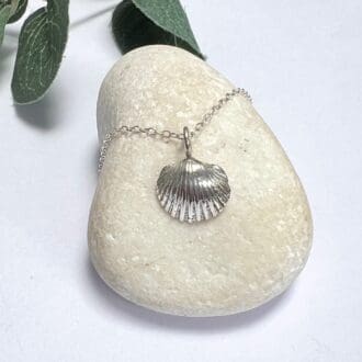 A dainty silver shell necklace, handmade from a real cockle shell