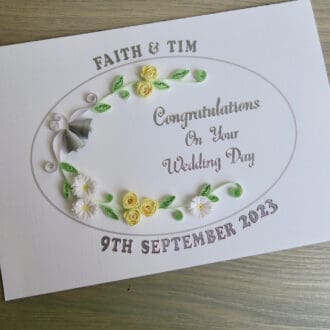 Handmade wedding card with quilled bells and roses