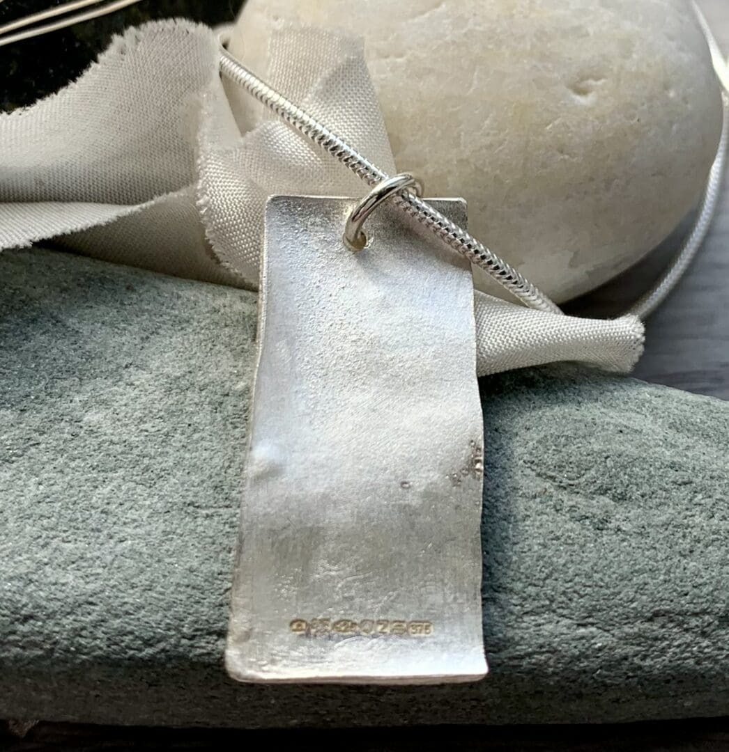 recycled silver and gold pendant with organic texture