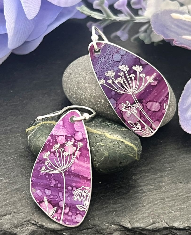 plum earrings with botanical detail