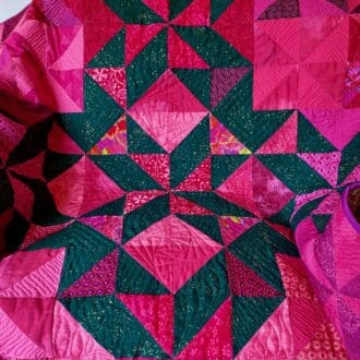 Pink and green baby triangle quilt