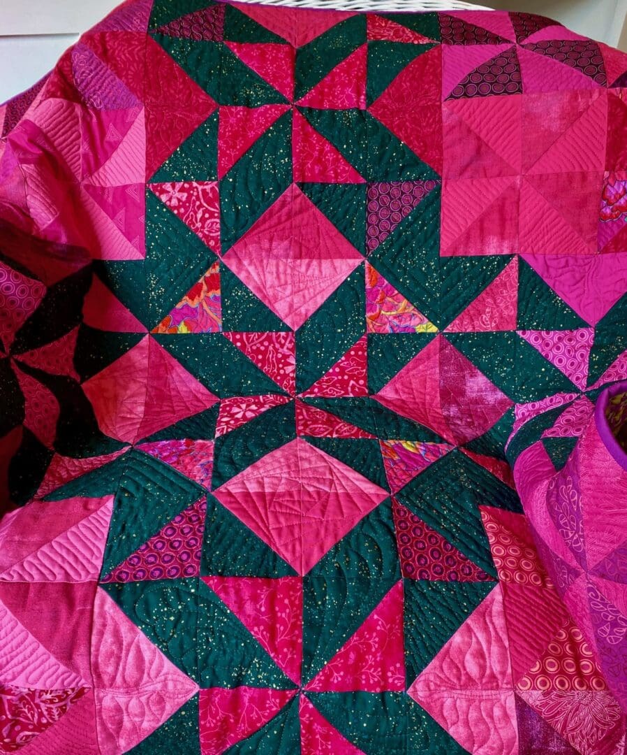 Pink and green baby triangle quilt