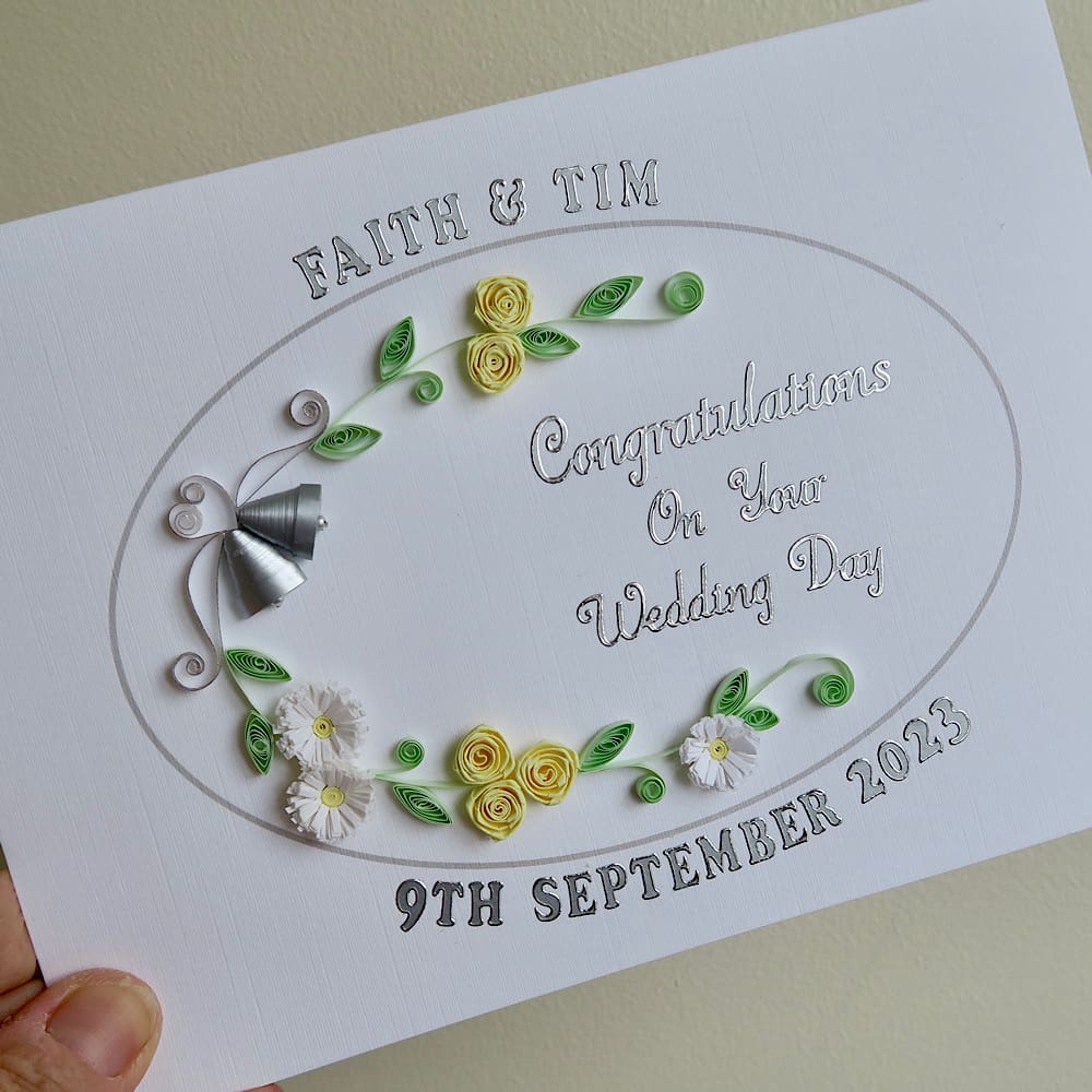 Handmade wedding card with quilled bells and roses