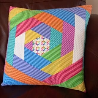 Rainbow quilted colourful cushion