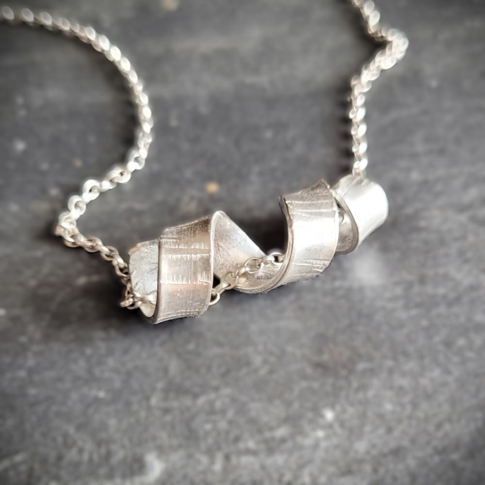 Sterling silver necklace with twisted spiral centrepiece reminiscent of silver birch tree bark.